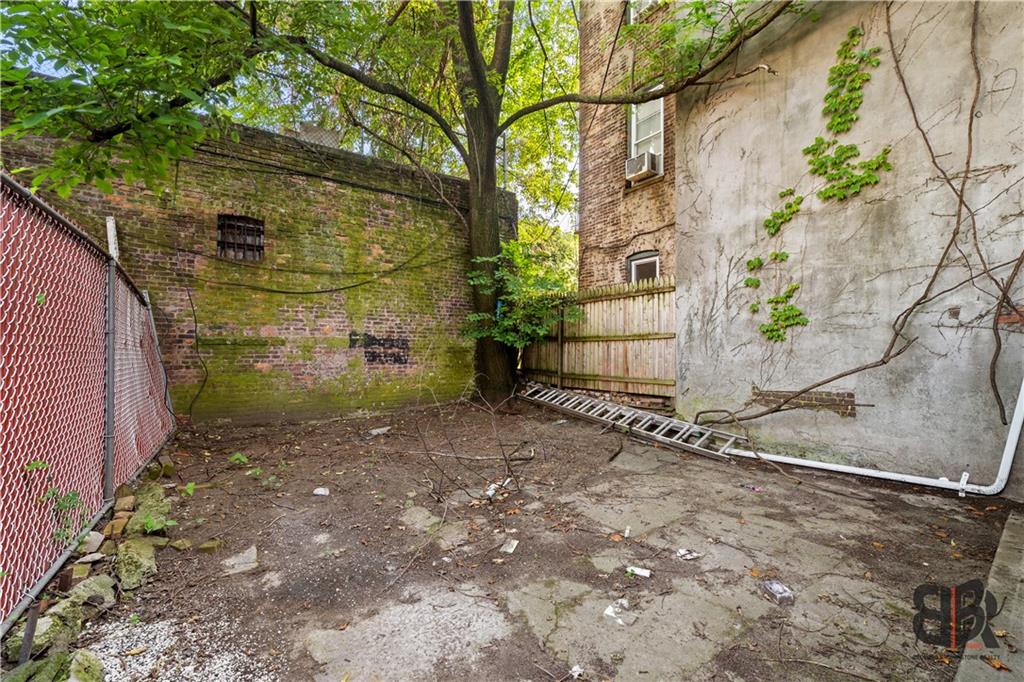 284 MacDougal Street Brooklyn, NY 11233 - Photo 21 of 23 a backyard of a house