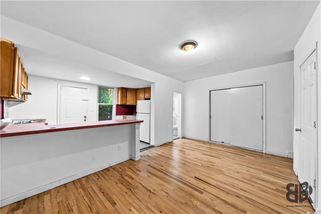 284 MacDougal Street Brooklyn, NY 11233 - Photo 4 of 23 a bedroom with a bed and a flat screen tv