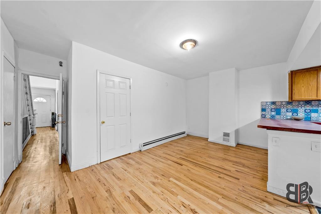284 MacDougal Street Brooklyn, NY 11233 - Photo 5 of 23 a view of a room with wooden floor and cabinet