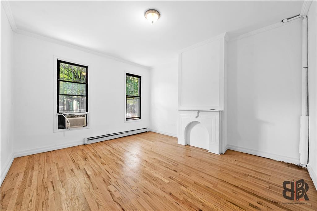 284 MacDougal Street Brooklyn, NY 11233 - Photo 6 of 23 a room with a bed and a window