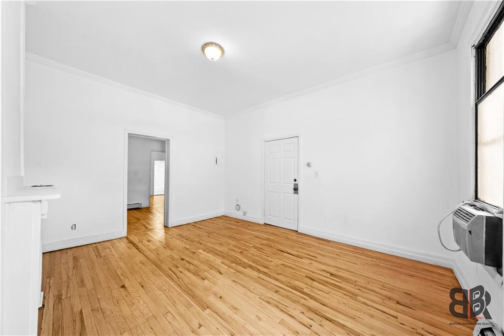 284 MacDougal Street Brooklyn, NY 11233 - Photo 8 of 23 a bedroom with a bed and a window