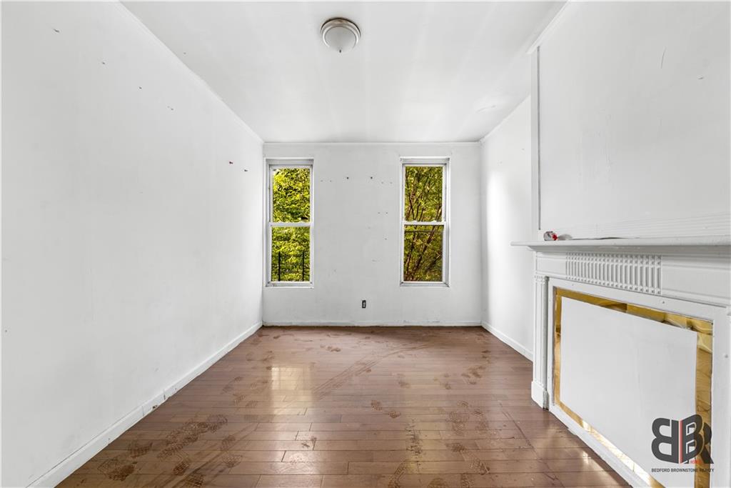 284 MacDougal Street Brooklyn, NY 11233 - Photo 10 of 23 an empty room with windows