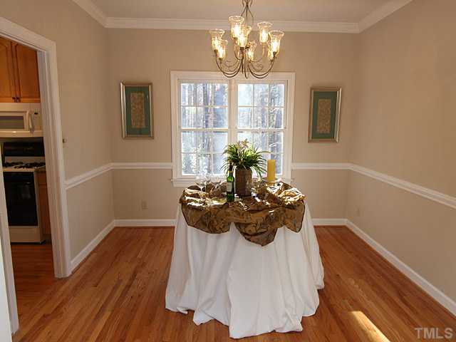 4311 Swarthmore Road Durham, NC 27707 - Photo 3 of 12 Classy dining room for intimate gatherings. 9 ft. ceilings, crown molding and chair rail.