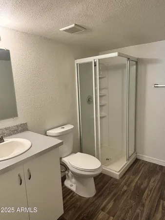 a white toilet sitting next to a bathroom sink