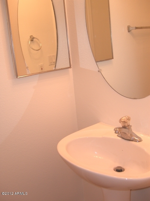 10422 East Bonnell Street Apache Junction, AZ 85120 - Photo 11 of 15 a bathroom with a sink and vanity