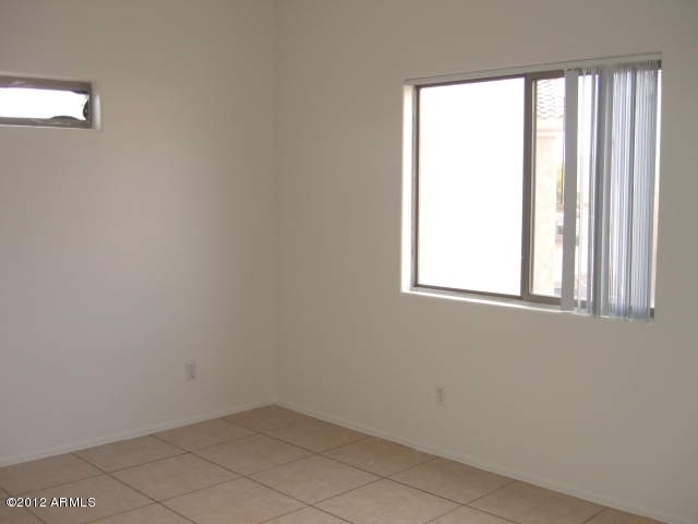 10422 East Bonnell Street Apache Junction, AZ 85120 - Photo 7 of 15 an empty room with windows