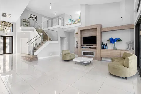a living room with furniture and white walls