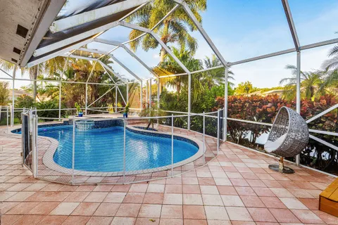 a view of a swimming pool with a lounge chair