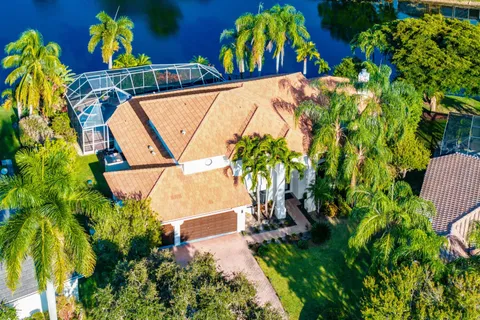 a view of a house with a yard and garden