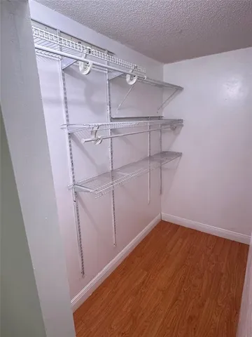 a view of a room with racks on the wall