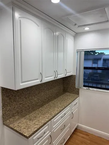 a view of cabinets and oven