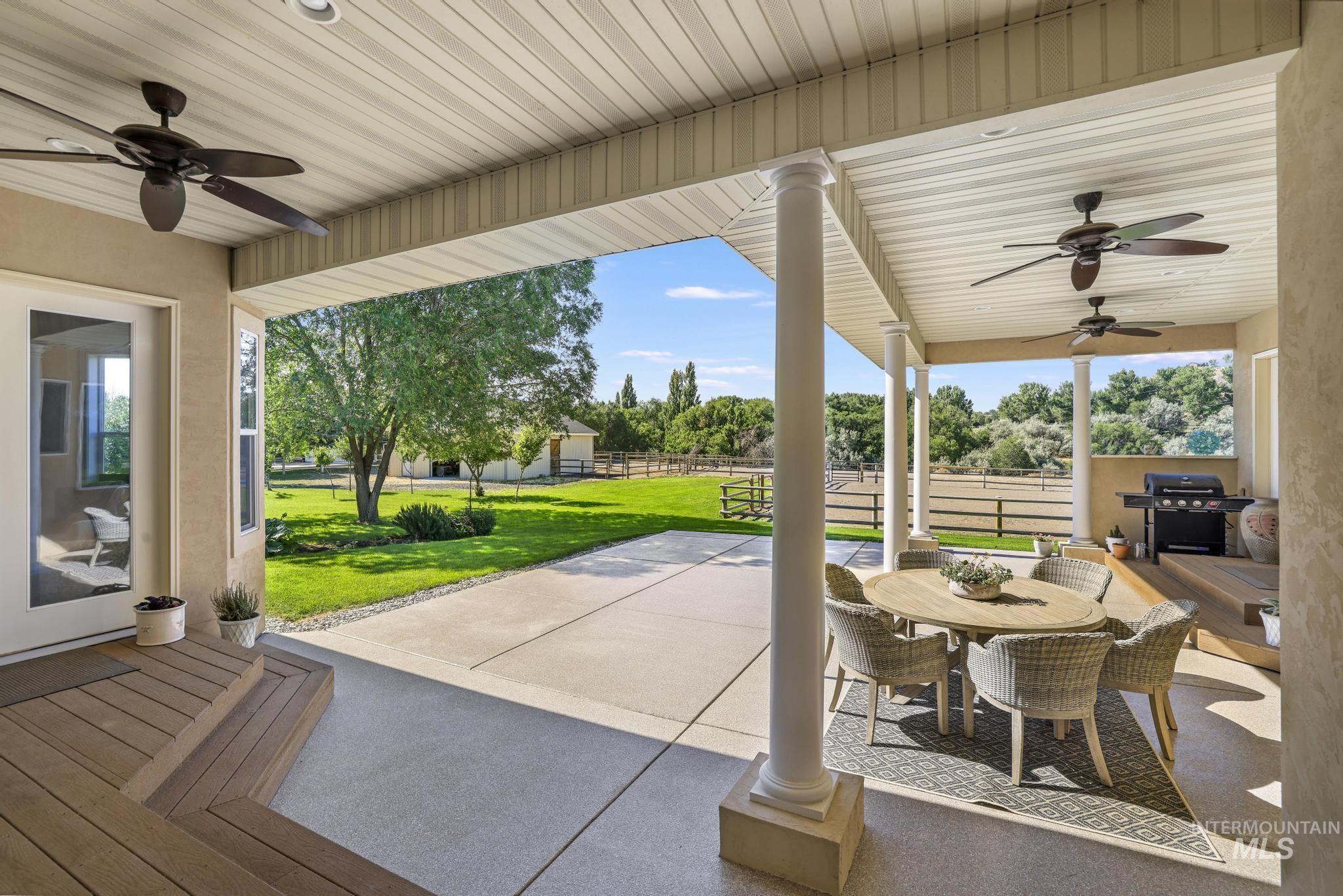 1301 Kanaka Rapids Road Buhl, ID 83316 - Photo 39 of 50 Expansive covered patio featuring multiple ceiling fans, recessed lighting, and support columns