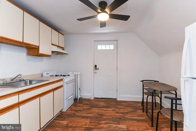 a kitchen with stainless steel appliances granite countertop a sink and cabinets