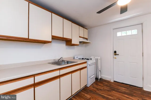a kitchen with stainless steel appliances granite countertop a sink and a cabinets