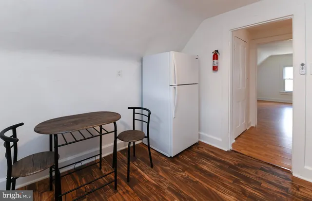 a view of a livingroom with furniture and wooden floor