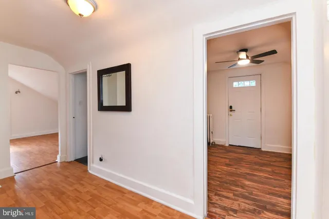a view of an entryway with wooden floor