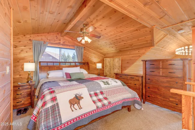 a bedroom with a bed and a table