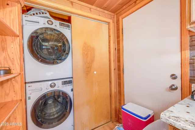 a view of a bedroom with washer and dryer