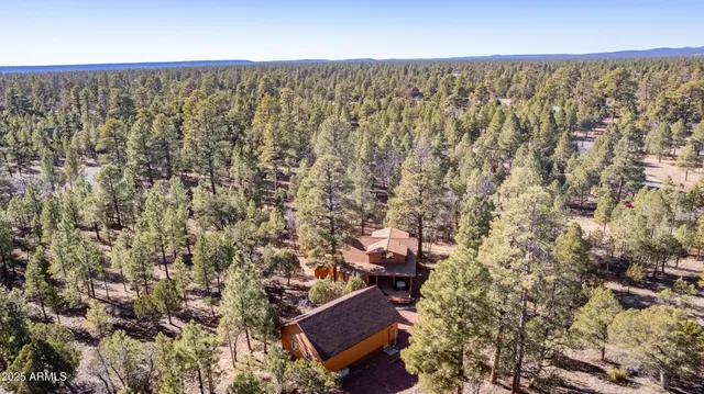 an aerial view of residential house with parking space