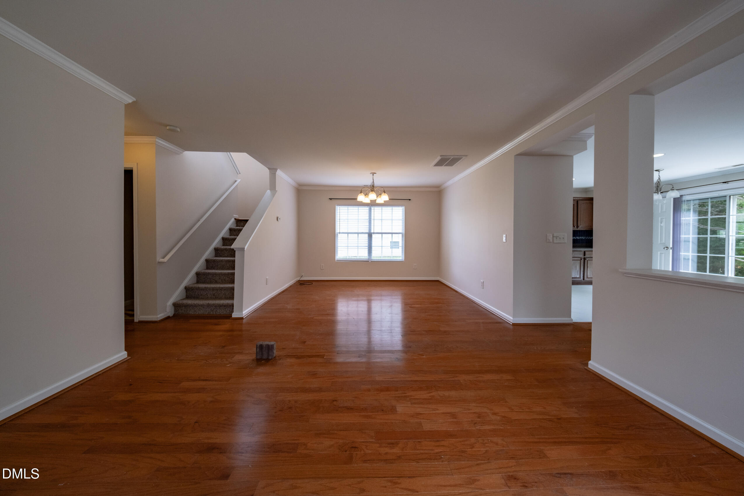 719 Obsidian Way Durham, NC 27703 - Photo 5 of 41 wooden floor in an empty room with a window