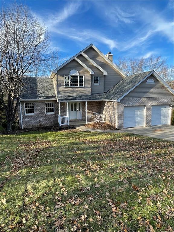 690 Adele Drive North Huntingdon, PA 15642 - Photo 2 of 25 a front view of a house with a garden