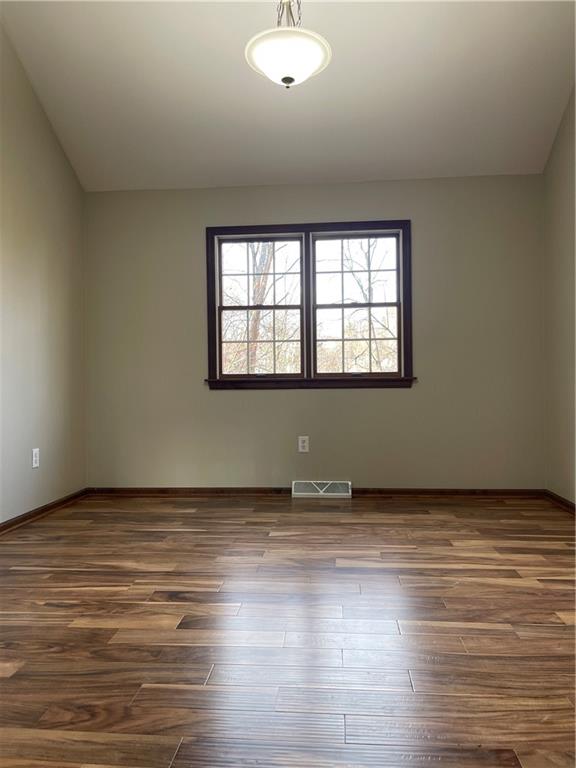 690 Adele Drive North Huntingdon, PA 15642 - Photo 11 of 25 an empty room with wooden floor and windows