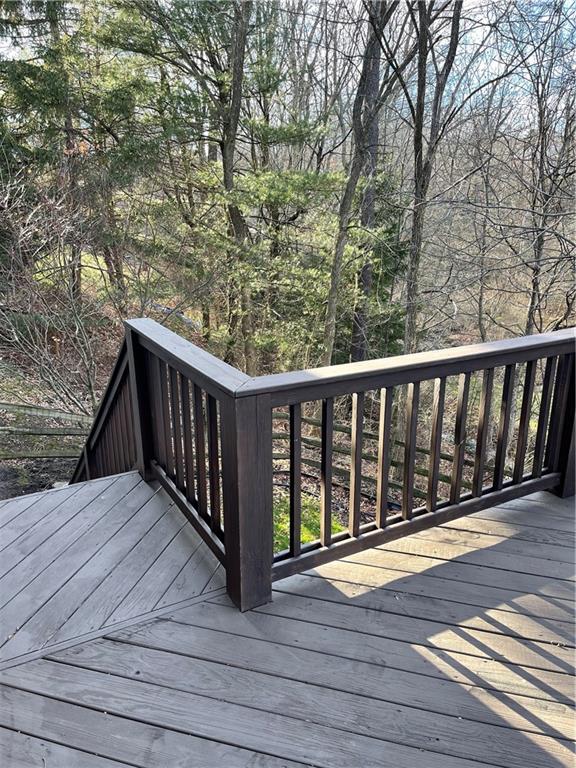 690 Adele Drive North Huntingdon, PA 15642 - Photo 17 of 25 a balcony with wooden floor and fence