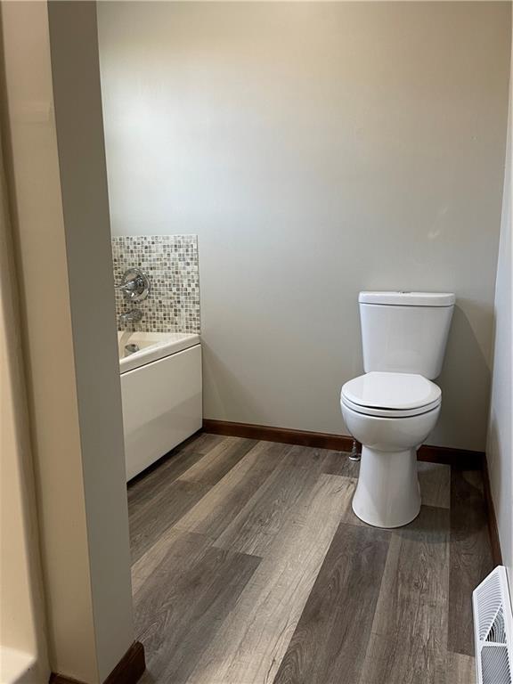 690 Adele Drive North Huntingdon, PA 15642 - Photo 23 of 25 a view of a room with wooden floor and a toilet