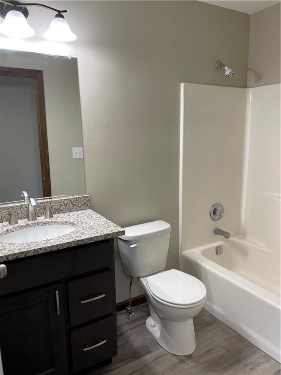 690 Adele Drive North Huntingdon, PA 15642 - Photo 24 of 25 a bathroom with a granite countertop toilet a sink and a bathtub