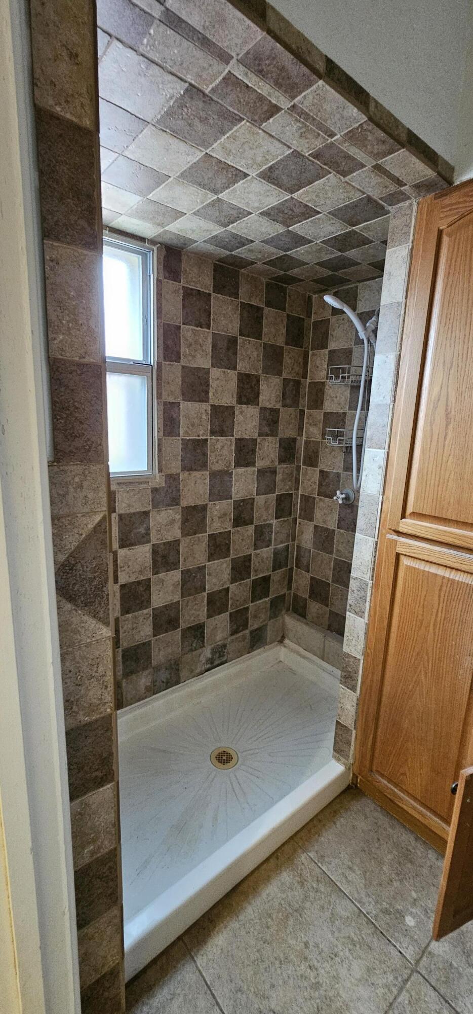 2007 62nd Street Lubbock, TX 79412 - Photo 7 of 17 a bathroom with a shower