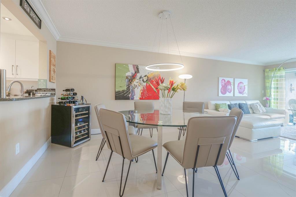 3930 Inverrary Boulevard, Unit 603D Lauderhill, FL 33319 - Photo 13 of 74 a view of a dining room with furniture