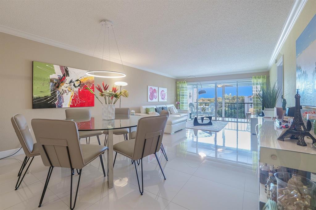 3930 Inverrary Boulevard, Unit 603D Lauderhill, FL 33319 - Photo 15 of 74 a table and chairs in a room