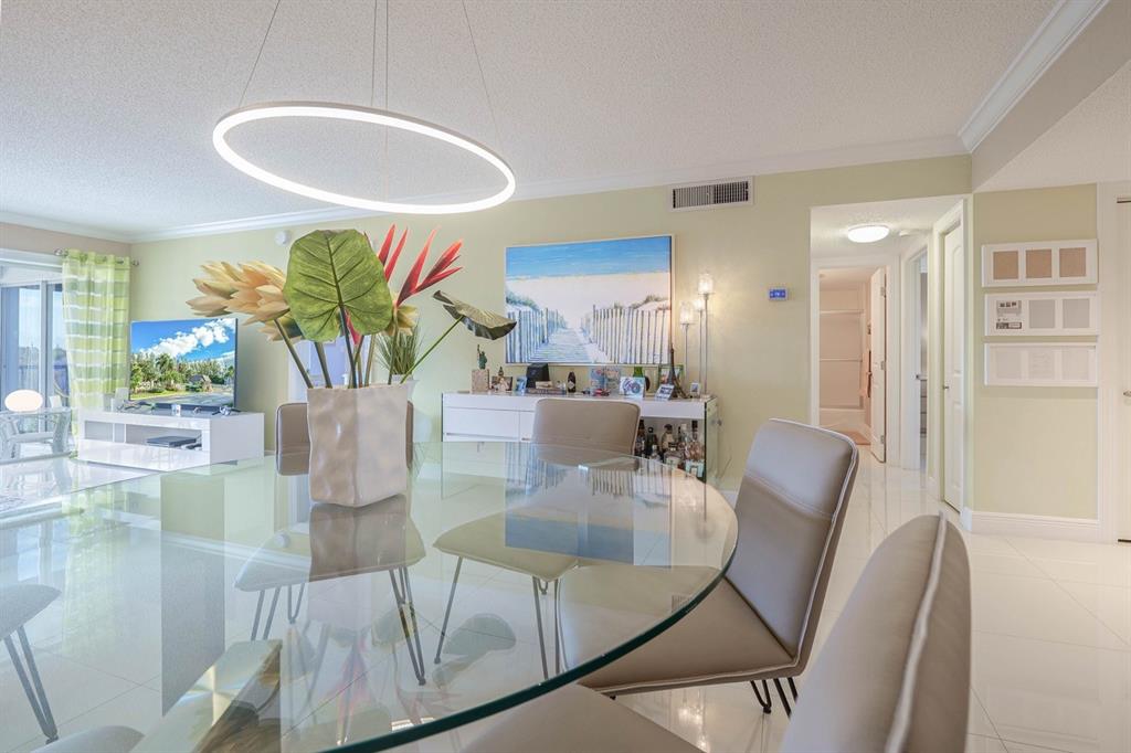 3930 Inverrary Boulevard, Unit 603D Lauderhill, FL 33319 - Photo 16 of 74 a view of a dining room with furniture
