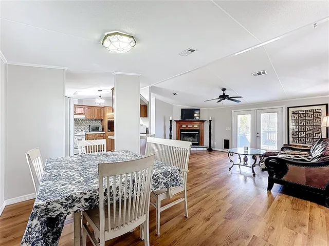 a kitchen with stainless steel appliances granite countertop a stove sink and cabinets
