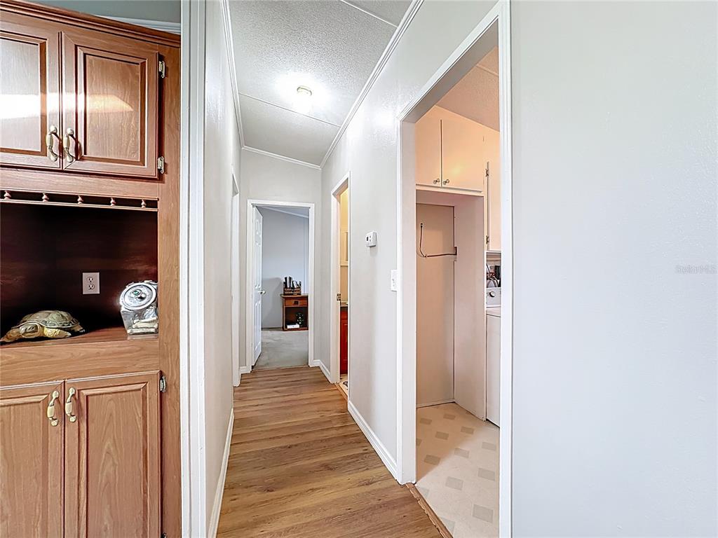4775 Cypress Creek Ranch Road St. Cloud, FL 34773 - Photo 18 of 63 a view of a hallway with wooden floor