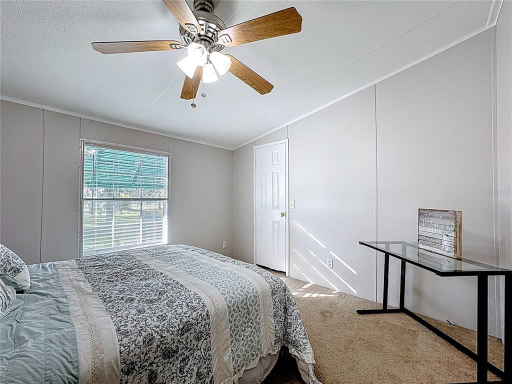 4775 Cypress Creek Ranch Road St. Cloud, FL 34773 - Photo 31 of 63 a bedroom with a bed and a window