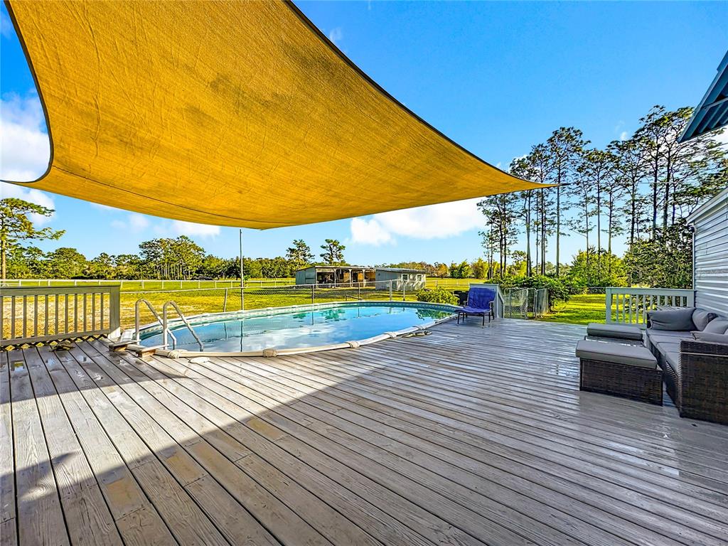 4775 Cypress Creek Ranch Road St. Cloud, FL 34773 - Photo 37 of 63 a view of swimming pool with lounge chair