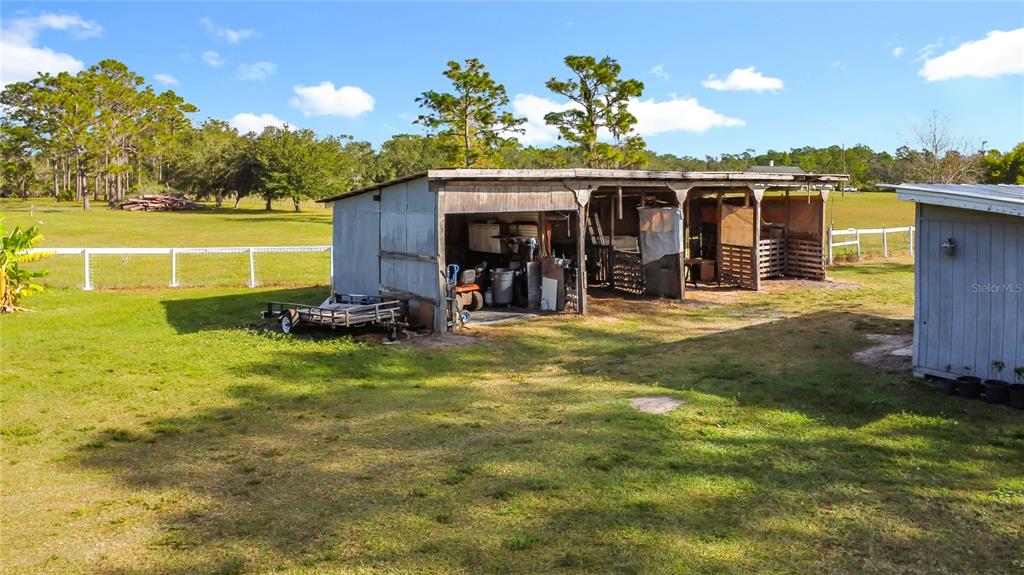 4775 Cypress Creek Ranch Road St. Cloud, FL 34773 - Photo 43 of 63 a view of a house with backyard and sitting area