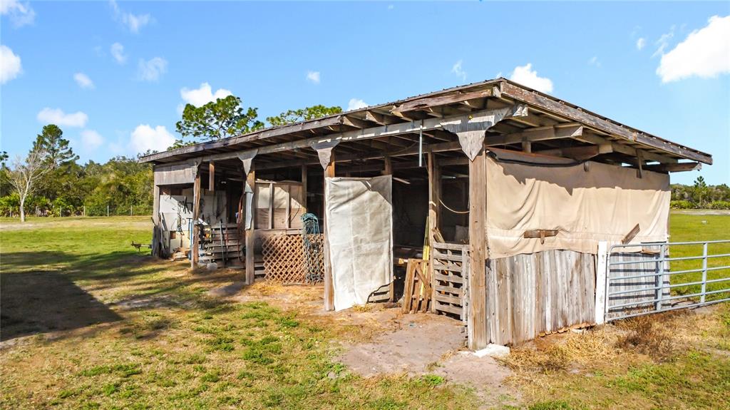 4775 Cypress Creek Ranch Road St. Cloud, FL 34773 - Photo 44 of 63 a view of a house with a yard