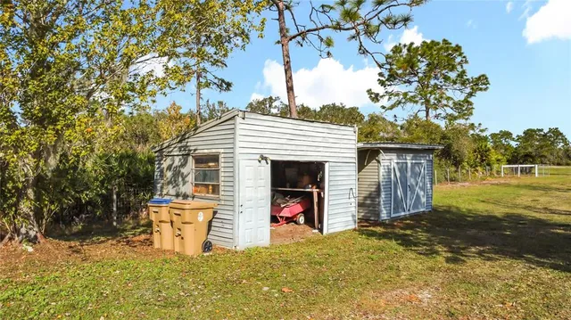 a view of a swimming pool with lounge chairs