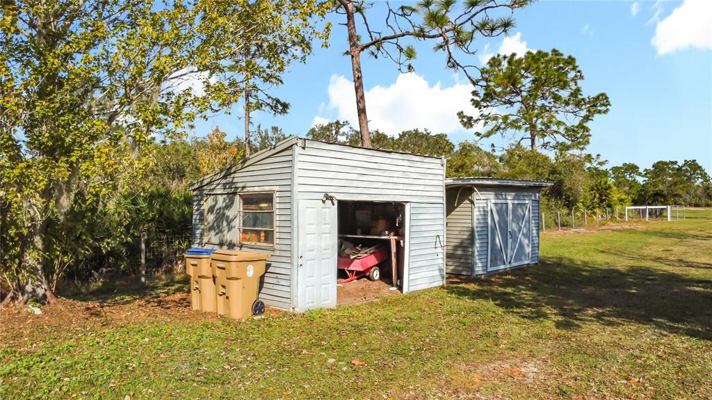 4775 Cypress Creek Ranch Road St. Cloud, FL 34773 - Photo 47 of 63 a view of a house with a backyard