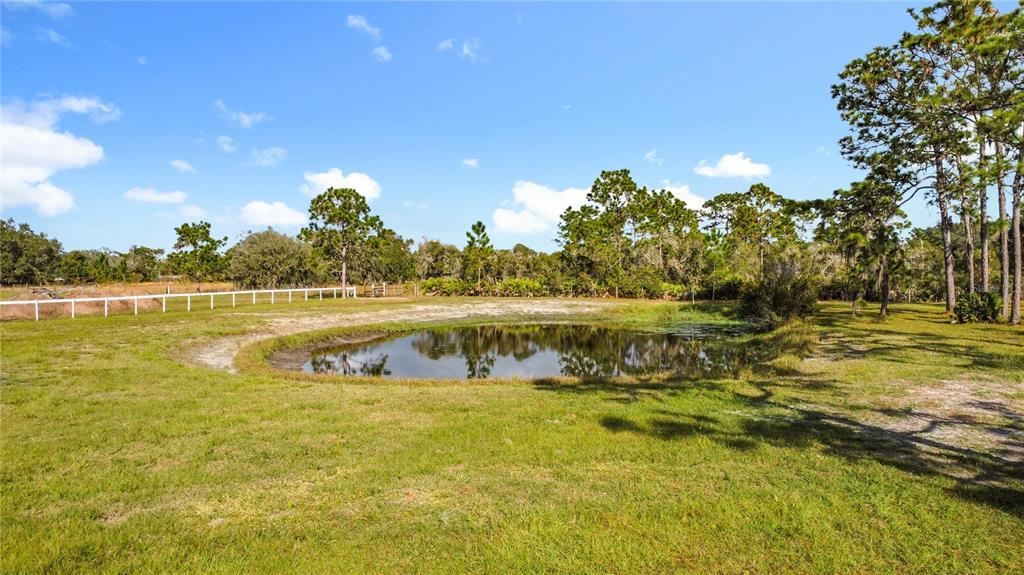 4775 Cypress Creek Ranch Road St. Cloud, FL 34773 - Photo 50 of 63 a view of a lake with houses in the background