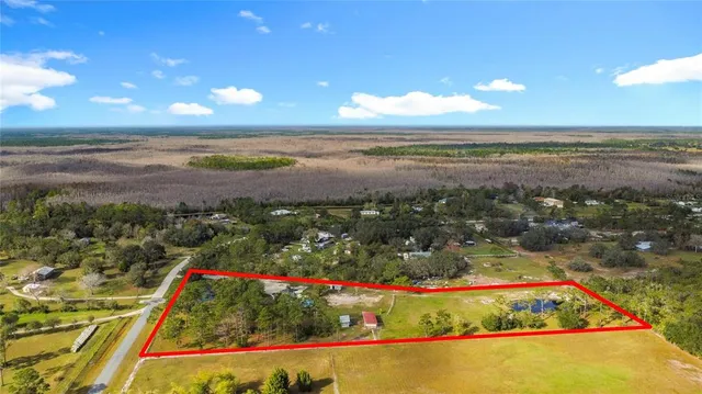 a front view of house with yard and outdoor seating