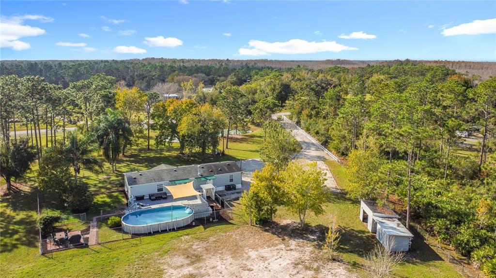 4775 Cypress Creek Ranch Road St. Cloud, FL 34773 - Photo 58 of 63 a view of a room with a yard and mountain view