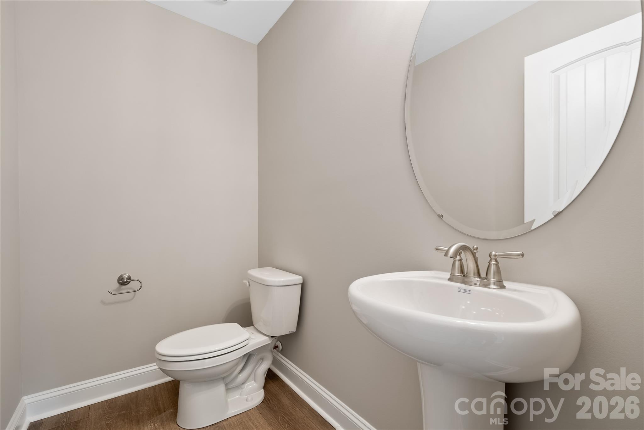 1007 Sioux Street Monroe, NC 28110 - Photo 13 of 39 a bathroom with a sink toilet and mirror