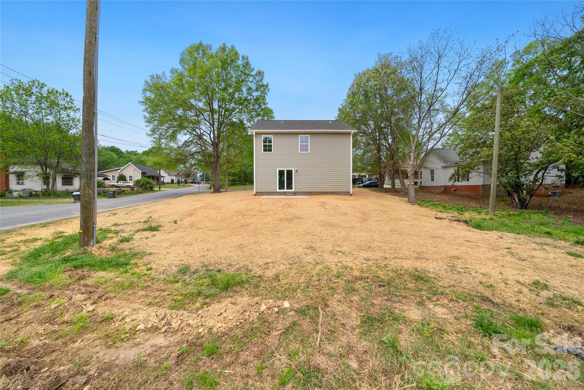 1007 Sioux Street Monroe, NC 28110 - Photo 32 of 39 a brick house with a big yard and large trees