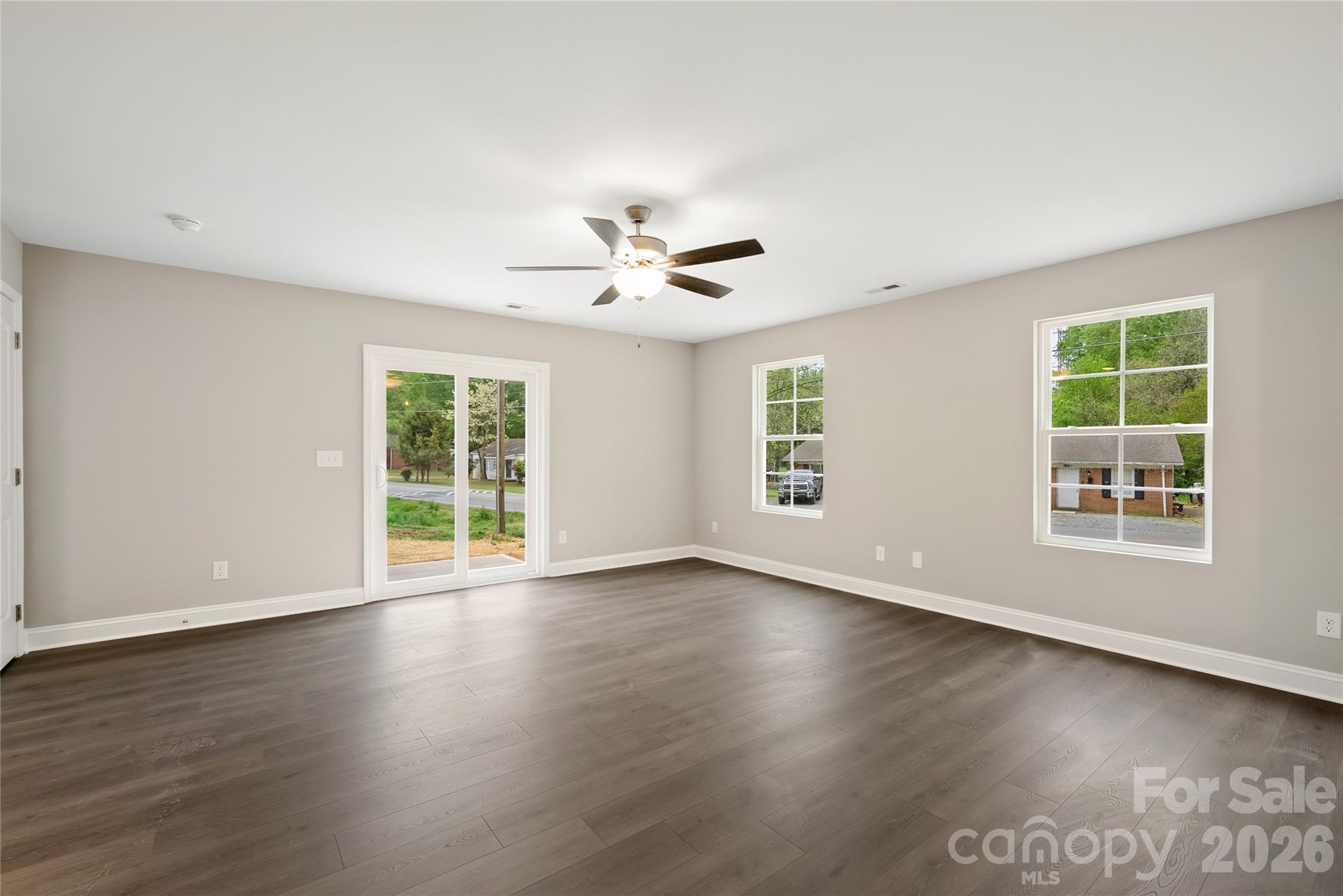 1007 Sioux Street Monroe, NC 28110 - Photo 5 of 39 a view of an empty room with wooden floor and a window