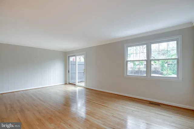 a view of a kitchen with a sink and a refrigerator