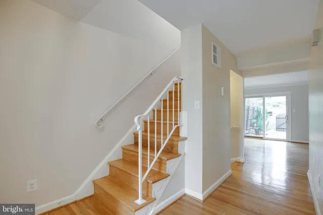 a view of a kitchen cabinets and refrigerator