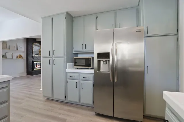 a kitchen with stainless steel appliances a refrigerator and a sink